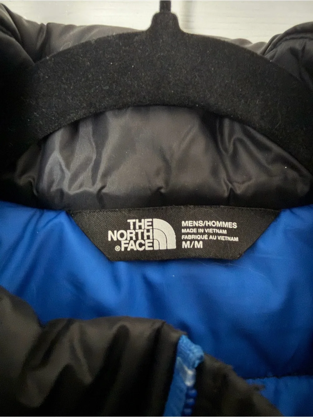 The North Face Black Quilted Down Vest with Blue Zippers